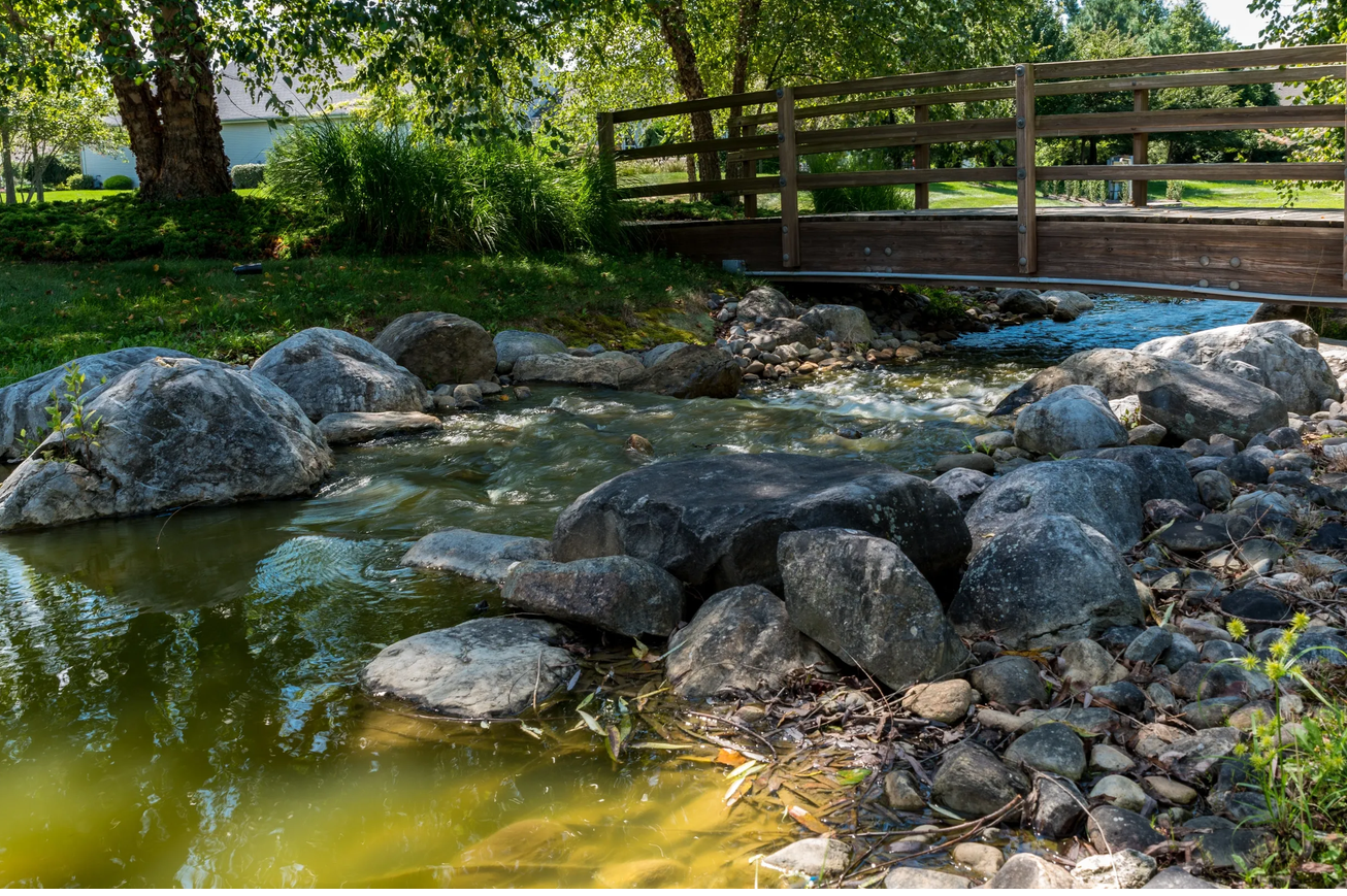Brook and wooden bridge